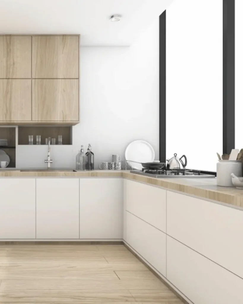 Scandinavian-inspired kitchen with woodgrain cabinetry and minimalist white drawers.