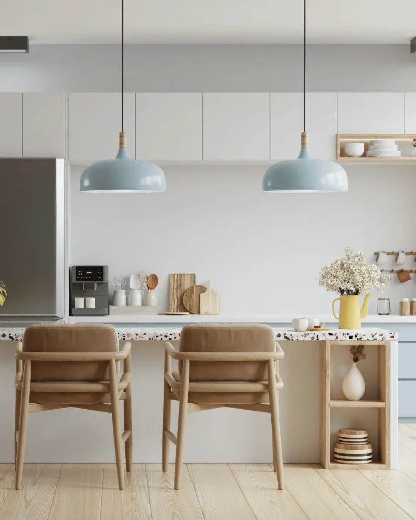 Contemporary kitchen with terrazzo breakfast bar, soft blue cabinetry and blonde timber stools.