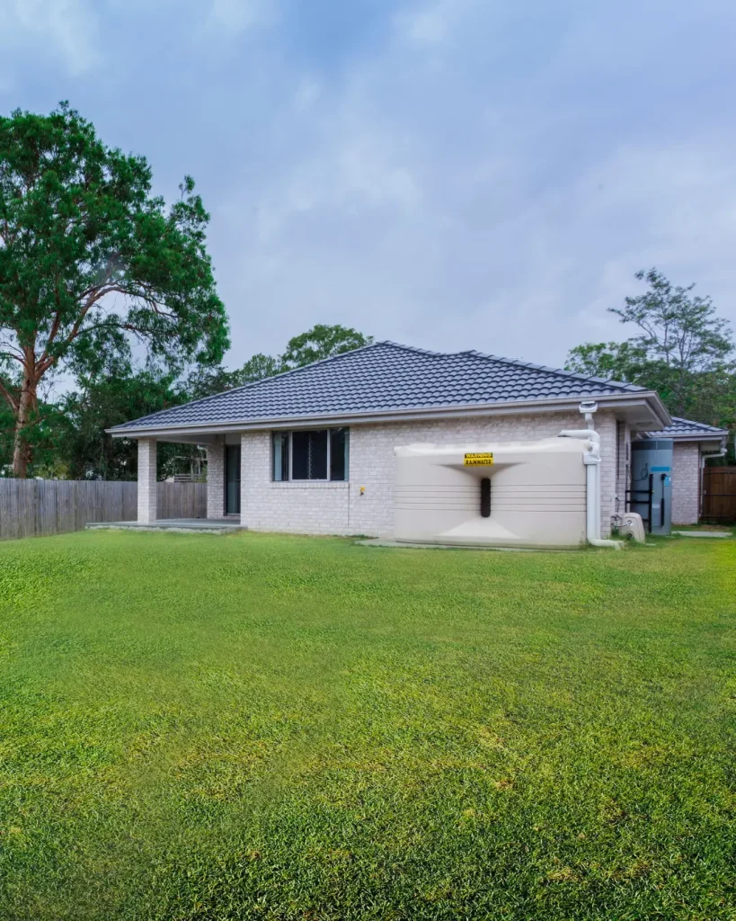 Modern brick home with large backyard, rainwater tank, and ample space for future granny flat.