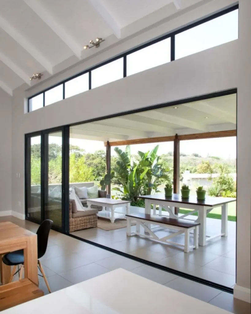 Open-plan living with seamless flow to covered outdoor dining area.