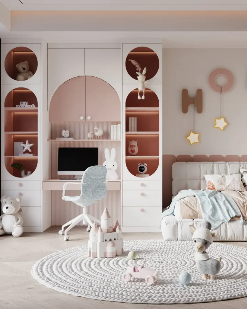 Kids’ room with built-in pink and white storage shelves, study desk, and playful decor.