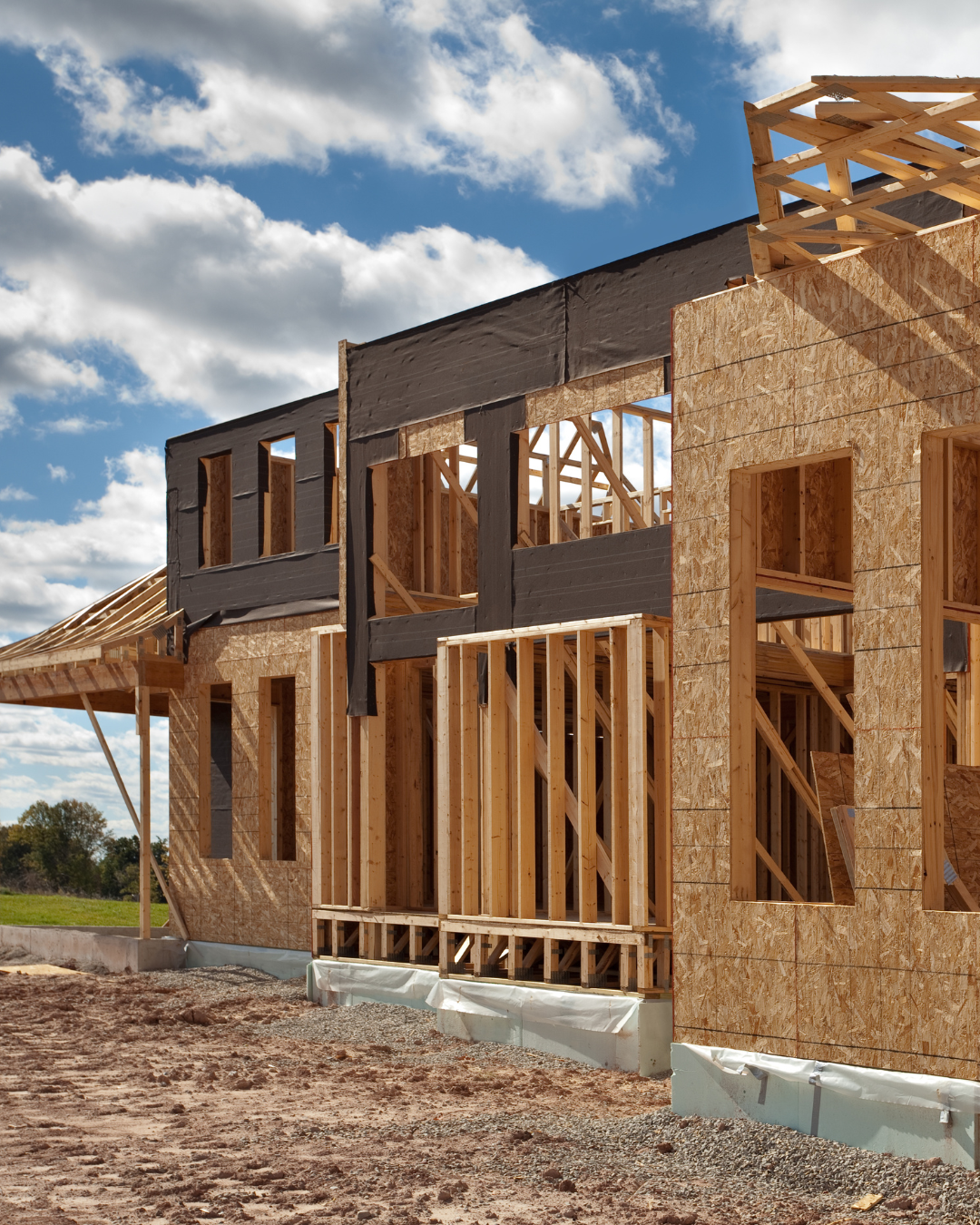 Timber frame construction of a two-storey home during the early building stage.