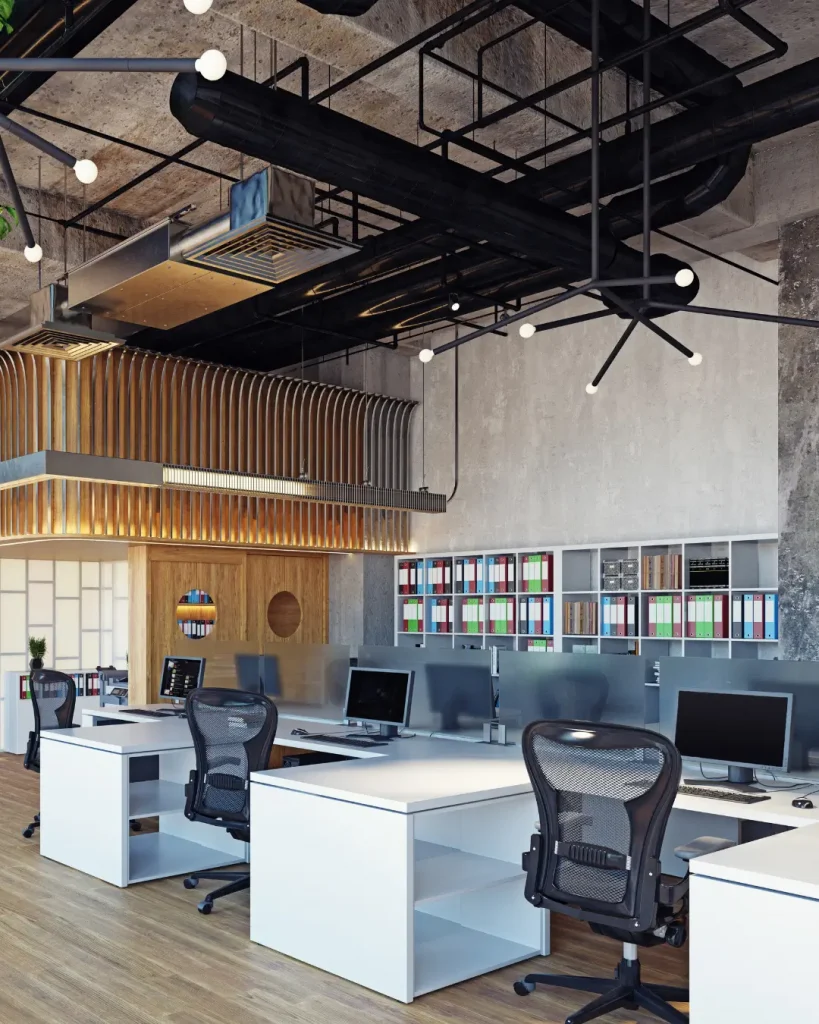 Modern office interior with exposed concrete ceiling, black ductwork, and ergonomic workstations