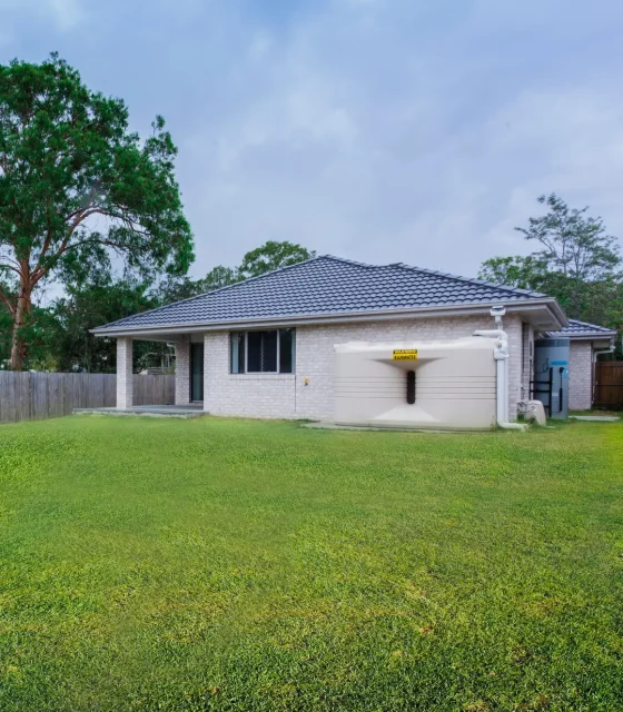 Modern brick home with large backyard, rainwater tank, and ample space for future granny flat.