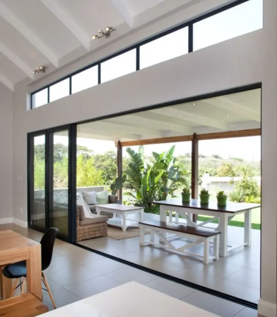 Open-plan living with seamless flow to covered outdoor dining area.