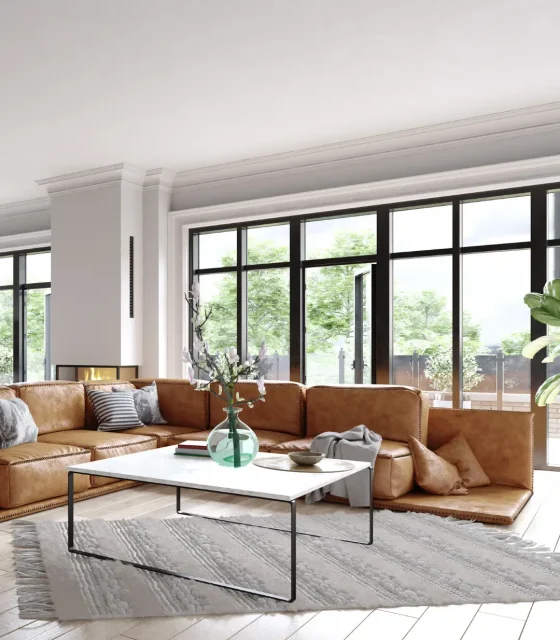 Elegant living space with leather sectional, floor-to-ceiling windows, and minimalist decor.